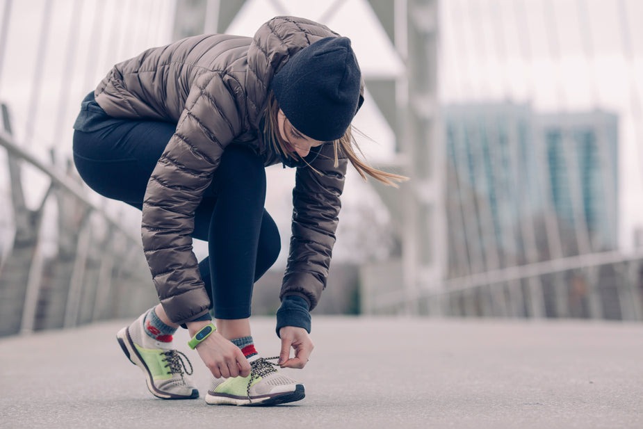 Female police candidate prepares for her fitness run. She uses police tests and interview preparation.