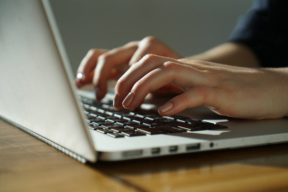 Police candidate types on a keyboard using Cognitive Results to prepare for their police test online.